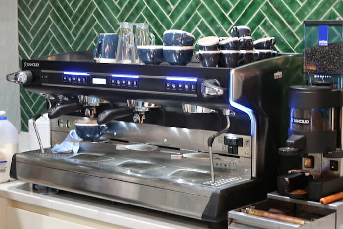 a coffee machine with cups on top