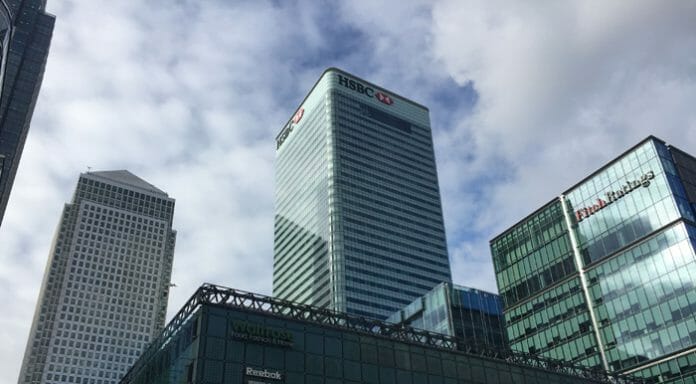 a tall building with glass walls