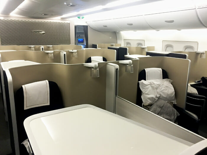 a seats and tables in an airplane