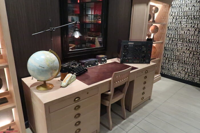 a desk with a globe and other objects on it