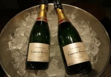 two bottles of champagne in a bucket of ice