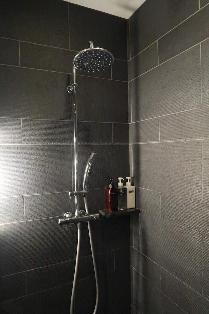 a shower head in a bathroom