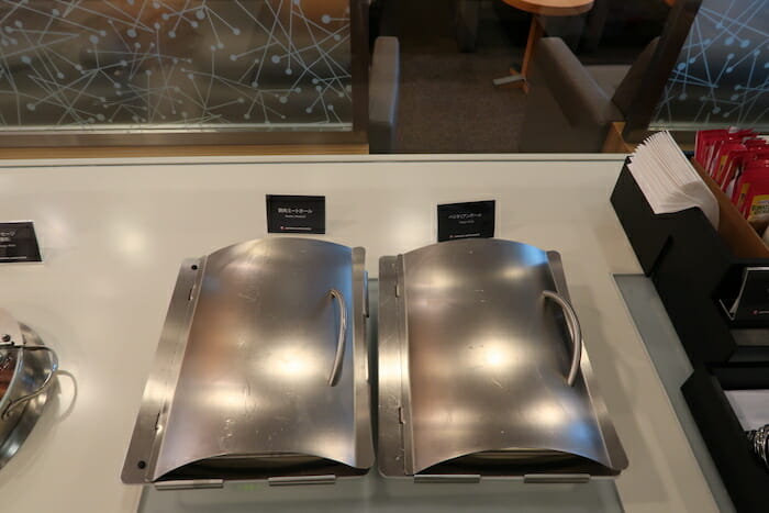 two metal trays on a table