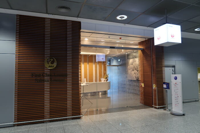 a glass door with a reception desk in front of it