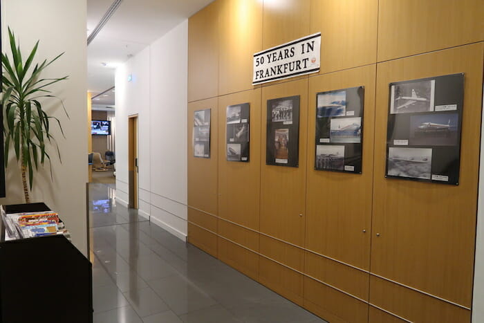 a hallway with pictures on the wall