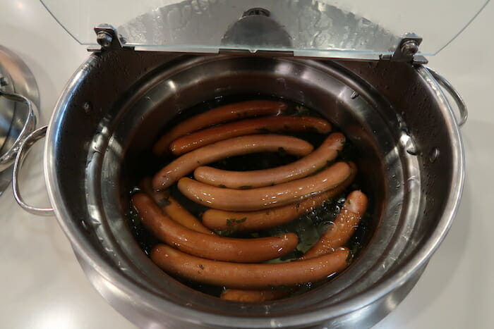 a group of sausages in a pot