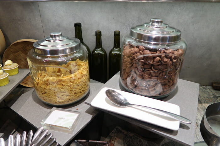 a couple of glass containers with cereal and cereals