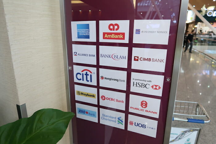 a group of logos on a glass wall