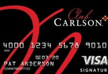 a credit card with red text and numbers