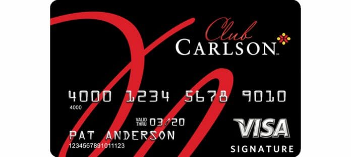 a credit card with red text and numbers