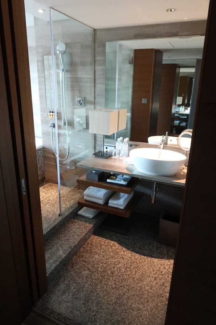 a bathroom with a glass shower door