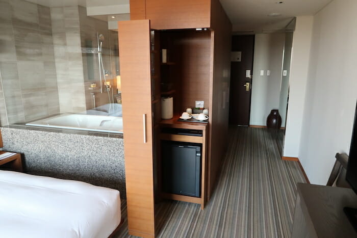 a room with a bed and a cabinet