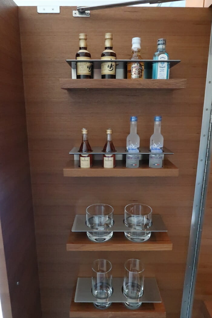 shelves with bottles and glasses on it