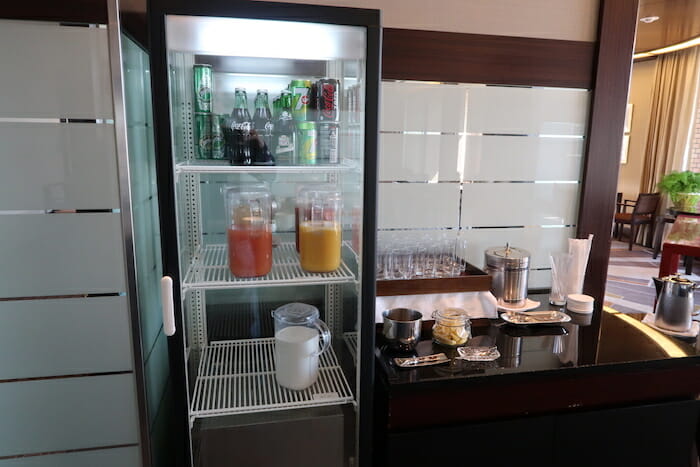 a refrigerator with drinks and beverages