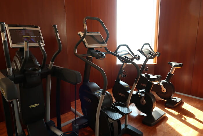 a group of exercise bikes in a room