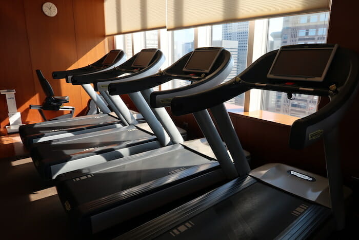 a row of treadmills in a gym