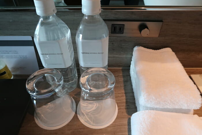 a group of bottles and glasses on a counter