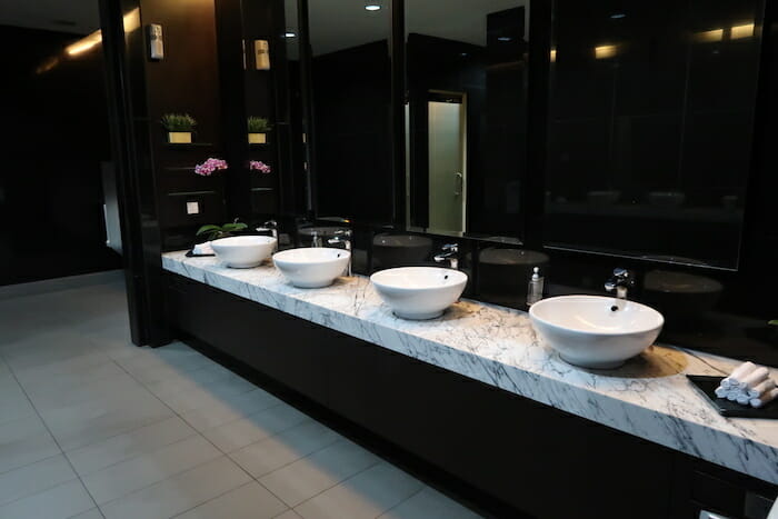 a bathroom with sinks and mirrors