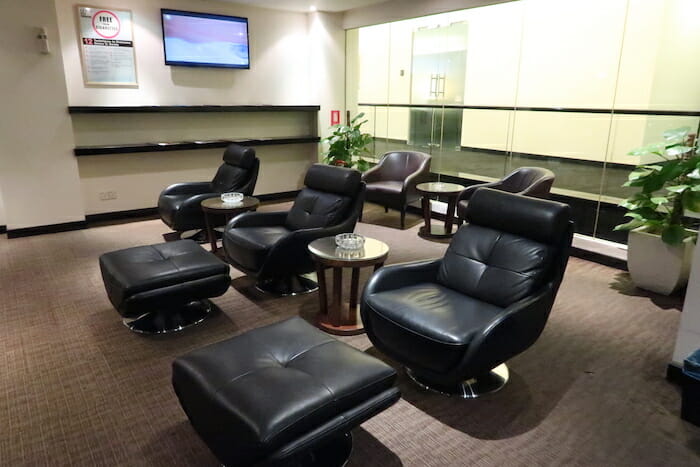 a group of black chairs and a table in a room