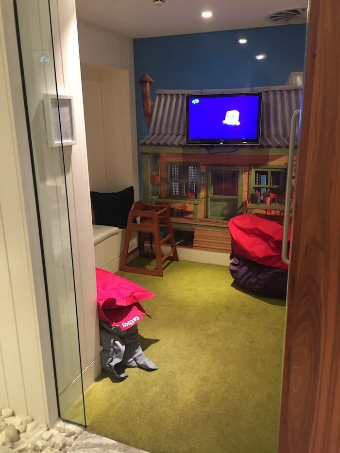 a room with a television on the wall