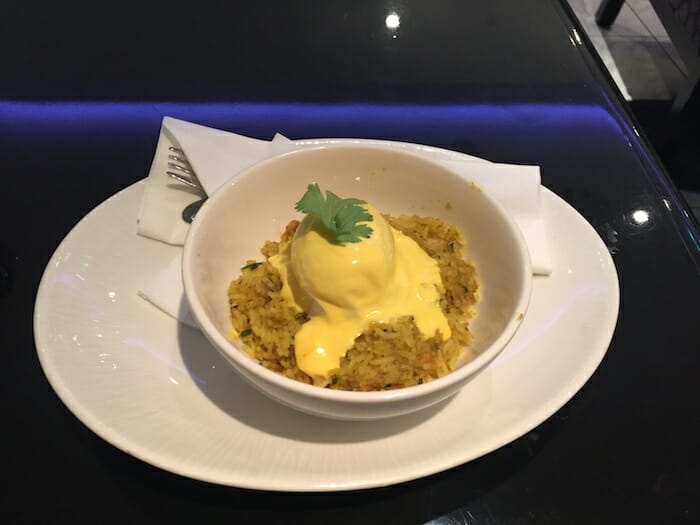 a bowl of food with a scoop of ice cream on top