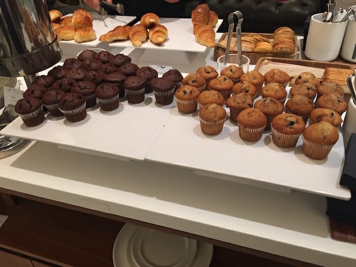 a tray of muffins and pastries