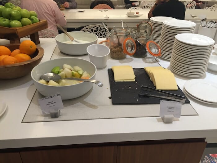 a table with plates and bowls of food