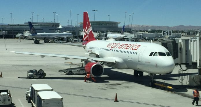 a large white airplane with red text on it