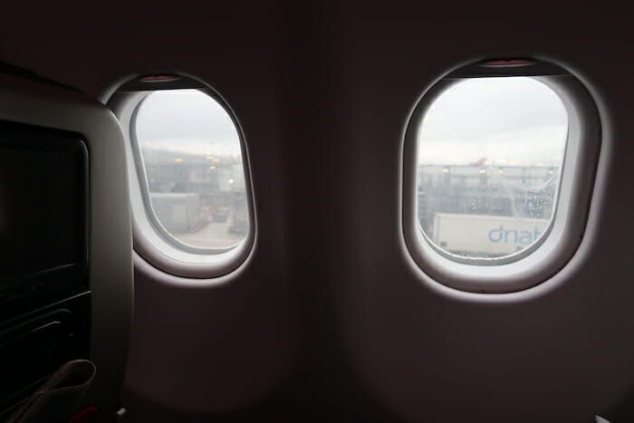 two windows with a view of a city