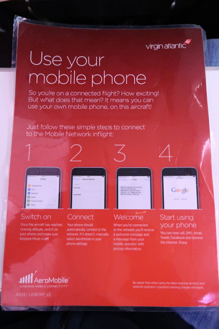 a red poster with text and pictures of cell phones