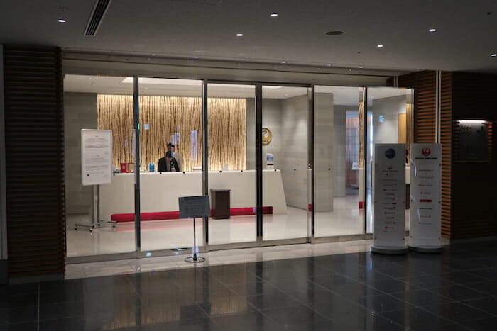 a man standing behind a reception desk