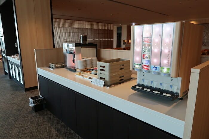 a counter with a machine and a tray of food