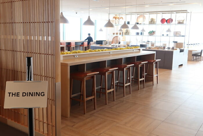 a room with a bar and stools