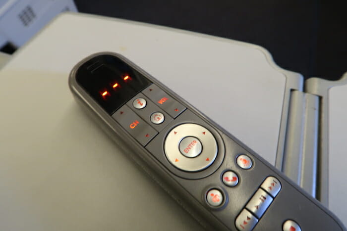 a remote control with buttons and lights