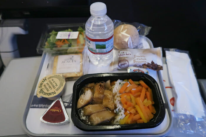 a tray of food and a bottle of water