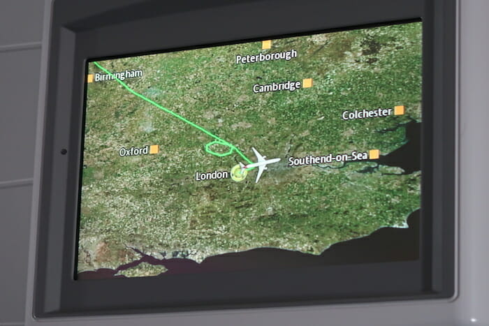 a screen with a map and a plane flying