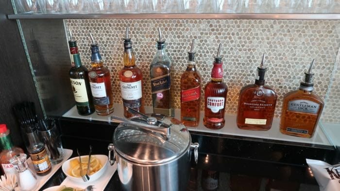 a row of liquor bottles on a counter