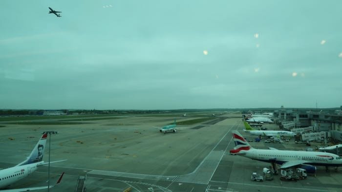 an airport with airplanes on the runway