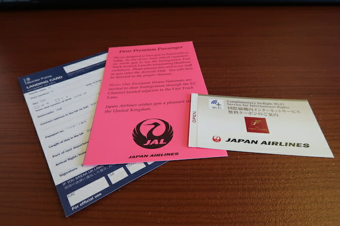 a group of tickets and a pink card