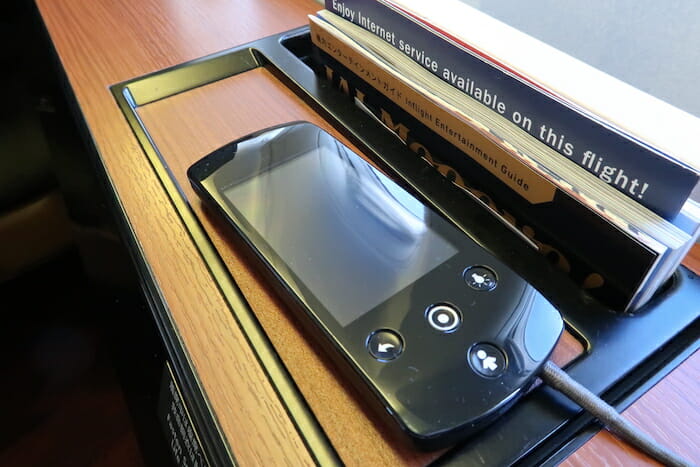 a cell phone on a shelf