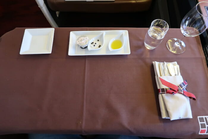 a table with plates and utensils on it