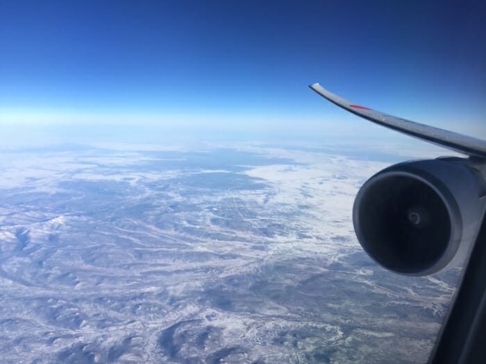 an airplane wing and the sky