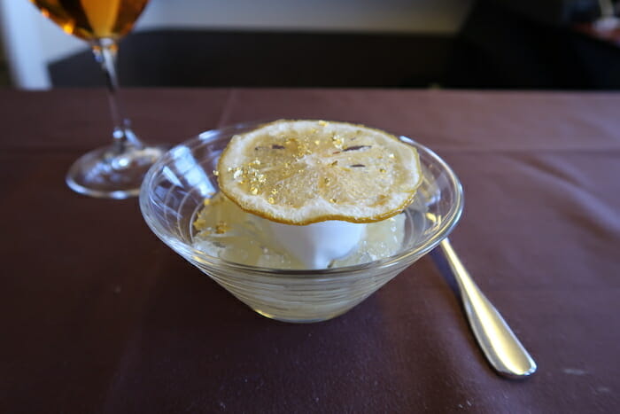 a lemon wedge in a glass bowl