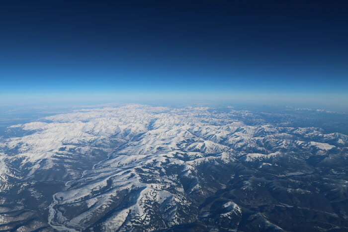 a aerial view of snowy mountains