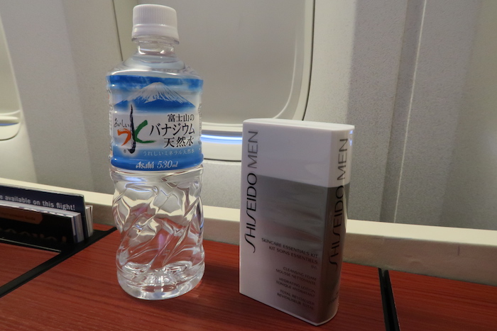 a bottle of water next to a box