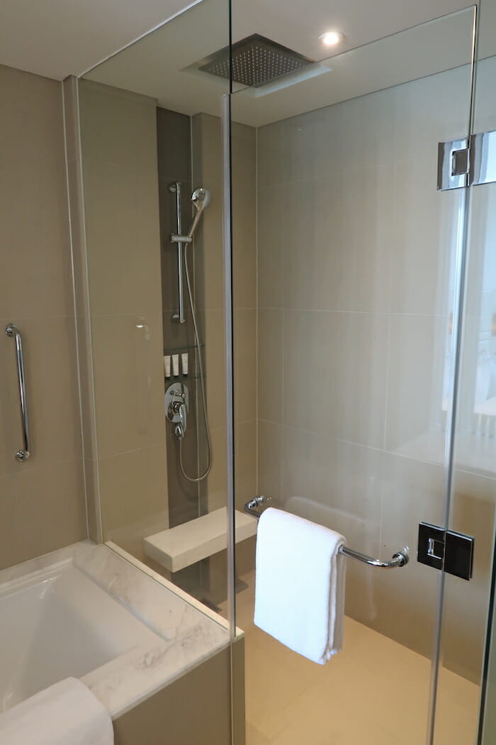 a glass shower door with a towel on it