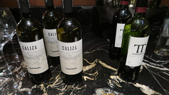 a group of wine bottles on a marble counter