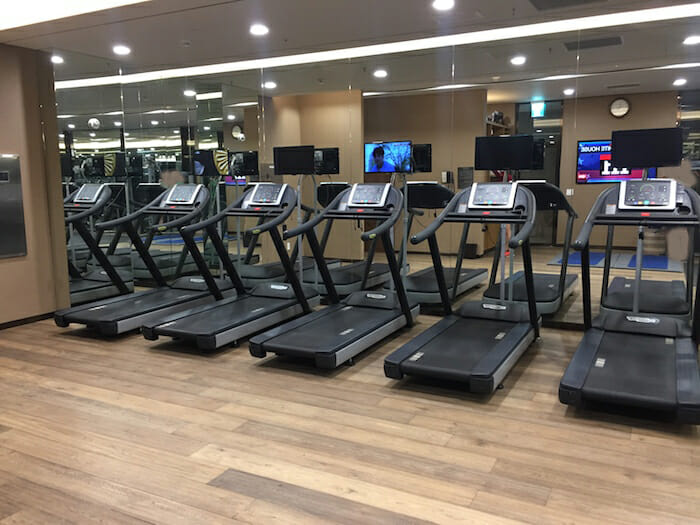 a group of treadmills in a gym