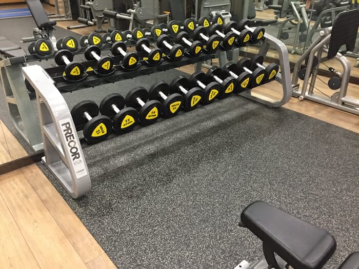 a group of dumbbells in a gym