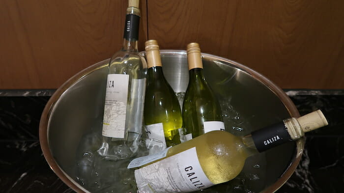 a group of bottles in a bucket of ice